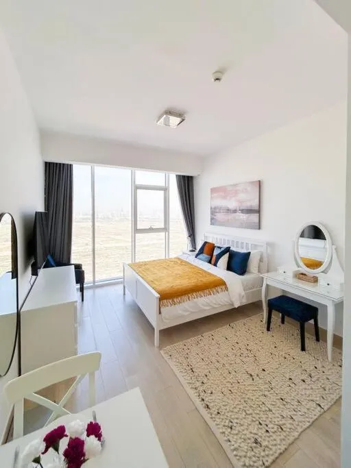 Image 3 of Bloom Studio in JVC – King Bed, Massive Pools, Indoor Parking