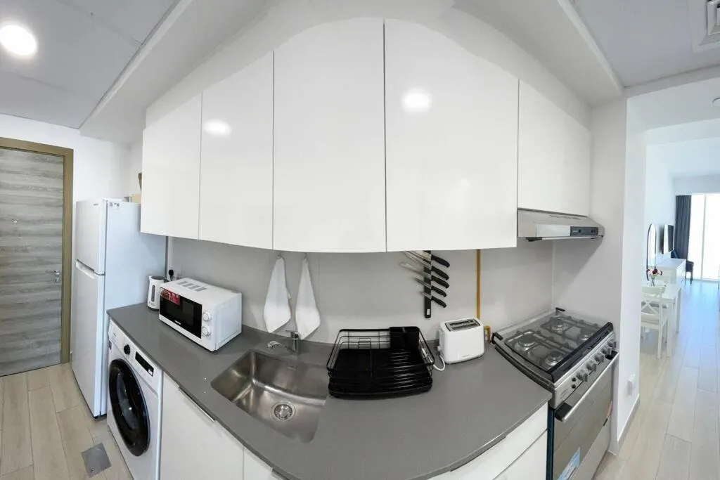 Image 4 of Bloom Studio in JVC – King Bed, Massive Pools, Indoor Parking